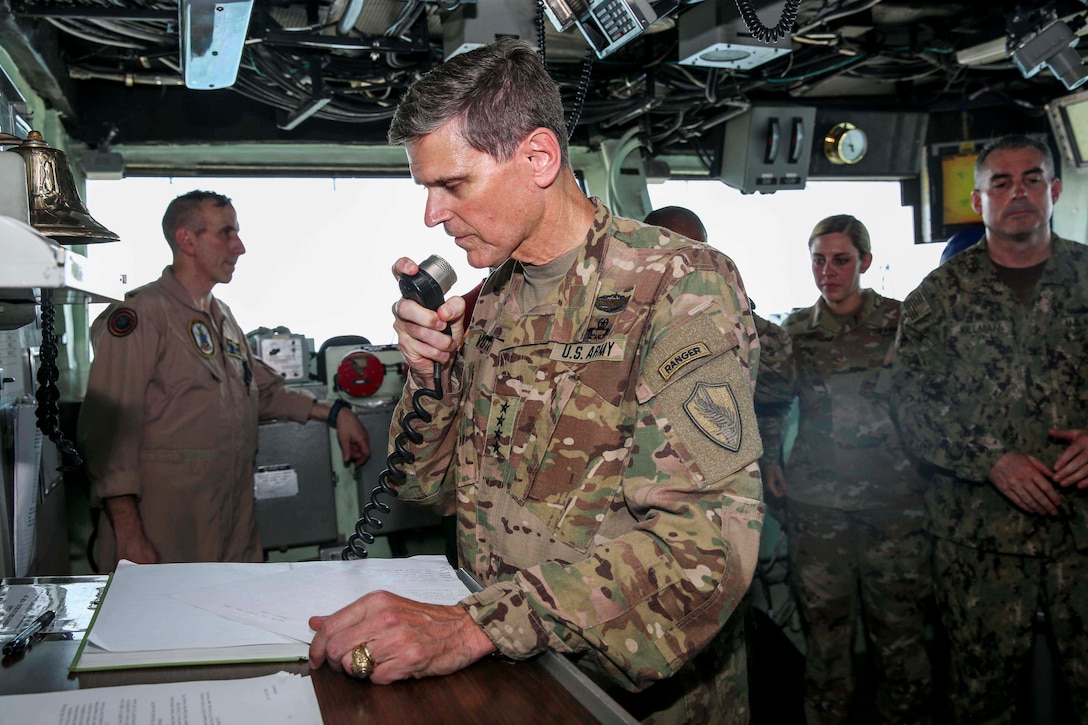 U.S. Army Gen. Joseph Votel, commander, U.S. Central Command, addresses the Marines and Sailors aboard the Wasp-class amphibious assault ship USS Iwo Jima (LHD 7), June 22, 2018. Votel, Vice Adm. Scott Stearney, commander, U.S. Naval Forces Central Command, and other distinguished visitors took a tour of Iwo Jima and spoke with crew members and Marines with the 26th Marine Expeditionary Unit, who are currently deployed to the U.S. 5th Fleet of operations in support of maritime security operations to reassure allies and partners and preserve the freedom of navigation and the free flow of commerce in the region. (U.S. Marine Corps photo by Cpl. Jon Sosner/Released)
