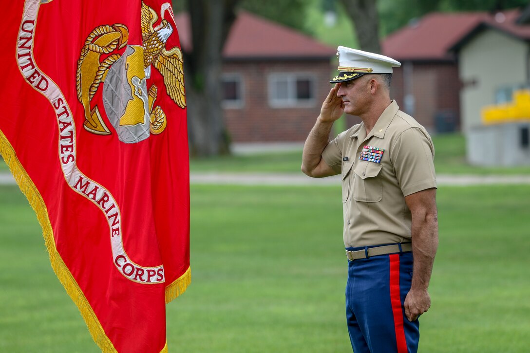 Maj. Brian Blaine, a Cleveland, Mississippi, native, salutes the colors during Marine Corps Recruiting Station Des Moines' change of command ceremony at Camp Dodge, in Johnston, Iowa, June 23, 2018. Blaine relinquished command of the “Wolfpack Nation” to Maj. Patrick J. Skehan, an Atlanta, Georgia, native. (Official Marine Corps photo by Sgt. Levi Schultz)