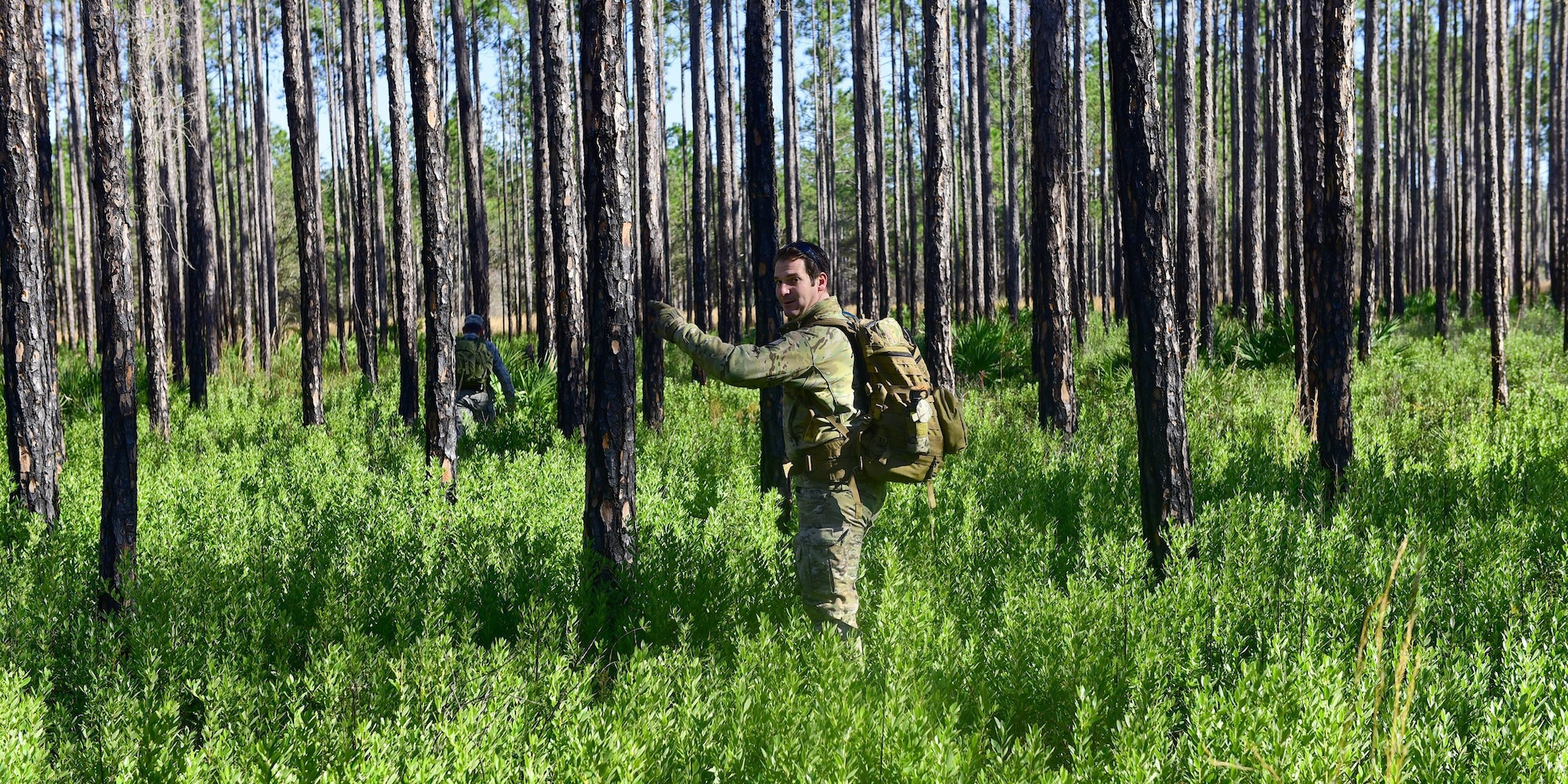 U.S. Staff Sgt. Jonathan Buchanan, 325th Operations Support Squadron non-commissioned officer in-charge of survival, evasion, resistance and escape (SERE) training, surveys a potential training area around Tyndall Air Force Base, Fla., for Tyndall’s SERE program, Jan. 17, 2018.