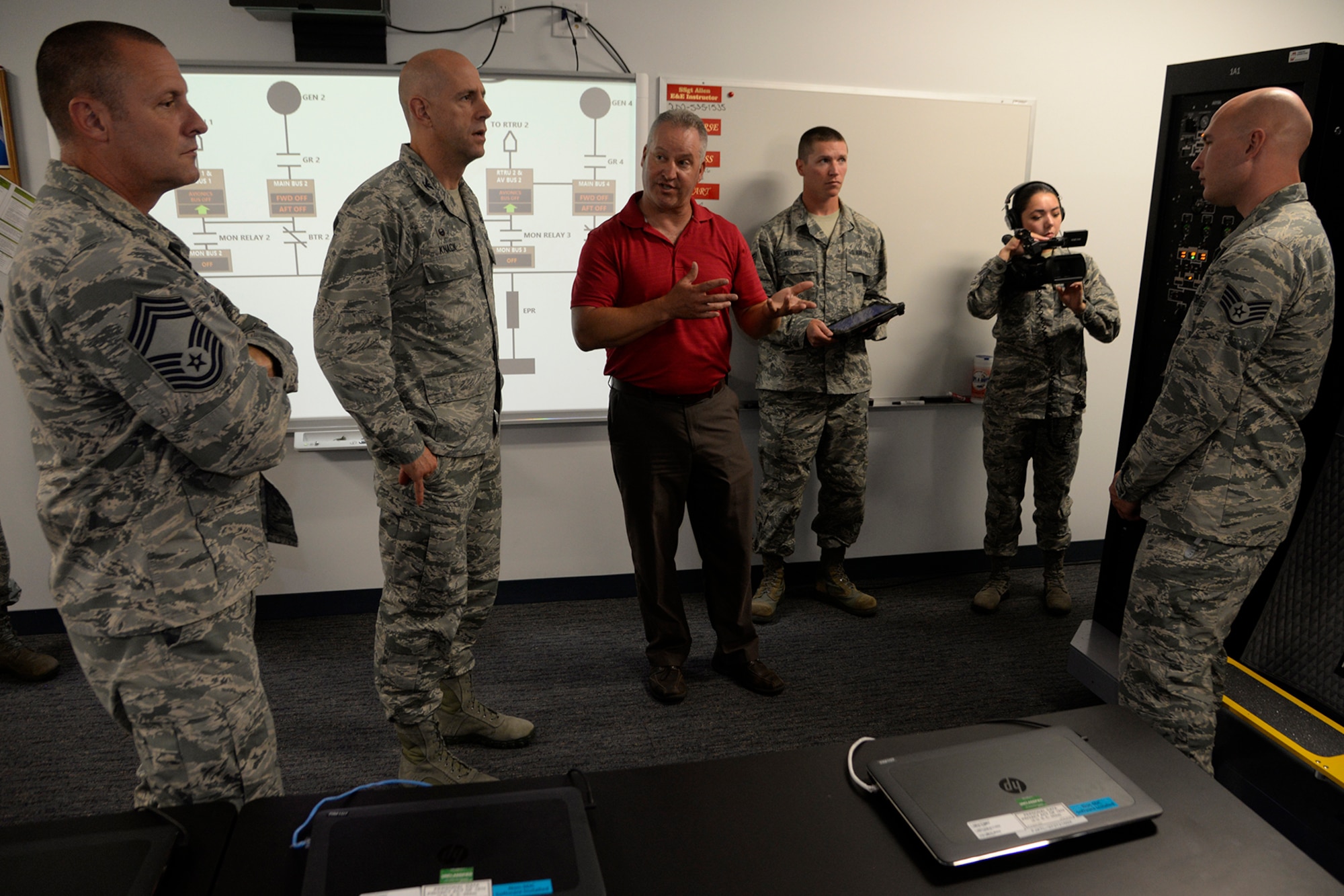 373rd Training Squadron Detachment 3 staff demonstrate the capabilities of the new C-5M Electrical Systems Trainer to Col. Tyler Knack, 436th Maintenance Group commander, and other members of maintenance leadership on Dover Air Force Base, Del., June 19, 2018.