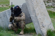 An Airman with the 841st Missile Security Forces Squadron takes cover during a training scenario June 24, 2018, at Fort Harrison, Mont.