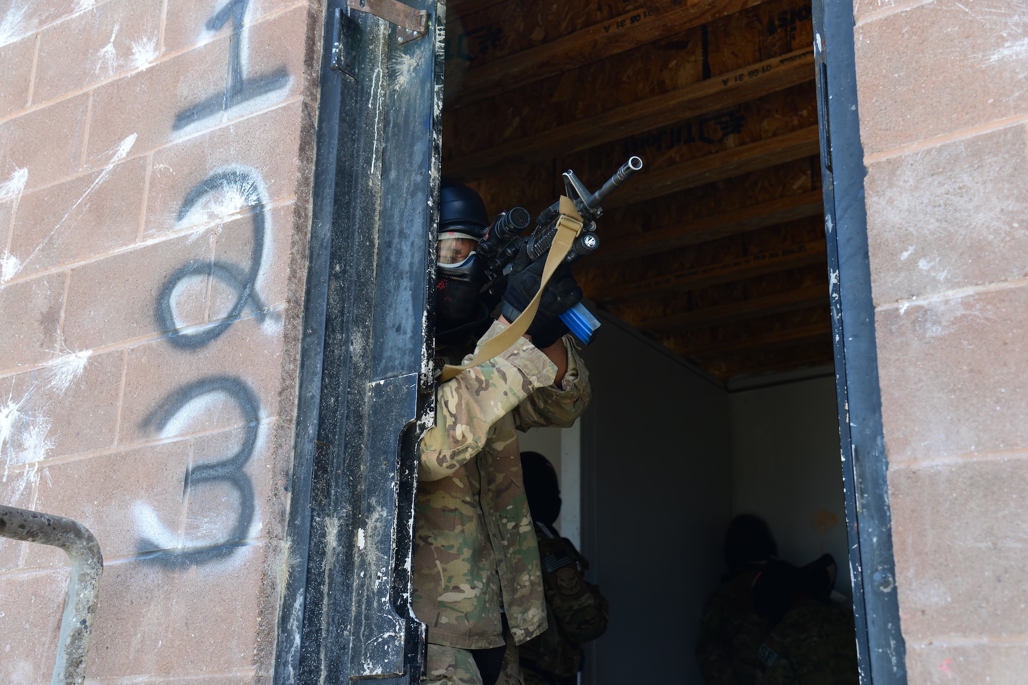 An Airman with the 841st Missile Security Forces Squadron locks on to a target while keeping cover during a training scenario June 24, 2018, at Fort Harrison, Mont.