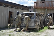 Airmen with the 841st Missile Security Forces Squadron corner an opposing member during a training scenario June 24, 2018, at Fort Harrison, Mont.