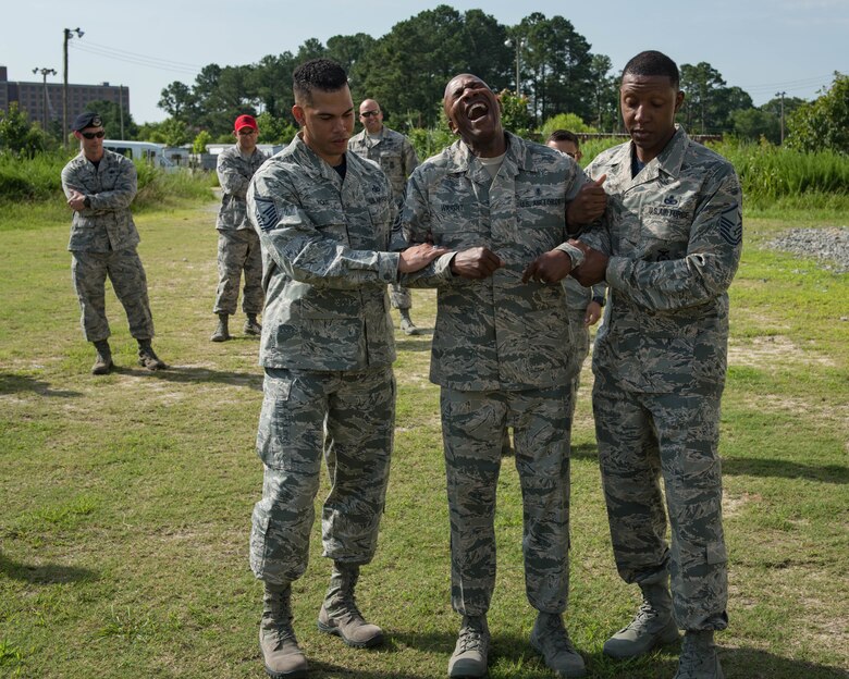 Chief Master Sgt. of the Air Force Kaleth O. Wright gets tased during his visit to Joint Base Langley-Eustis, Virginia, June 29, 2018. Wright toured JBLE for two days seeing the day-to-day operations of the different wings and units here. (U.S. Air Force photo by Airman 1st Class Anthony Nin-Leclerec)