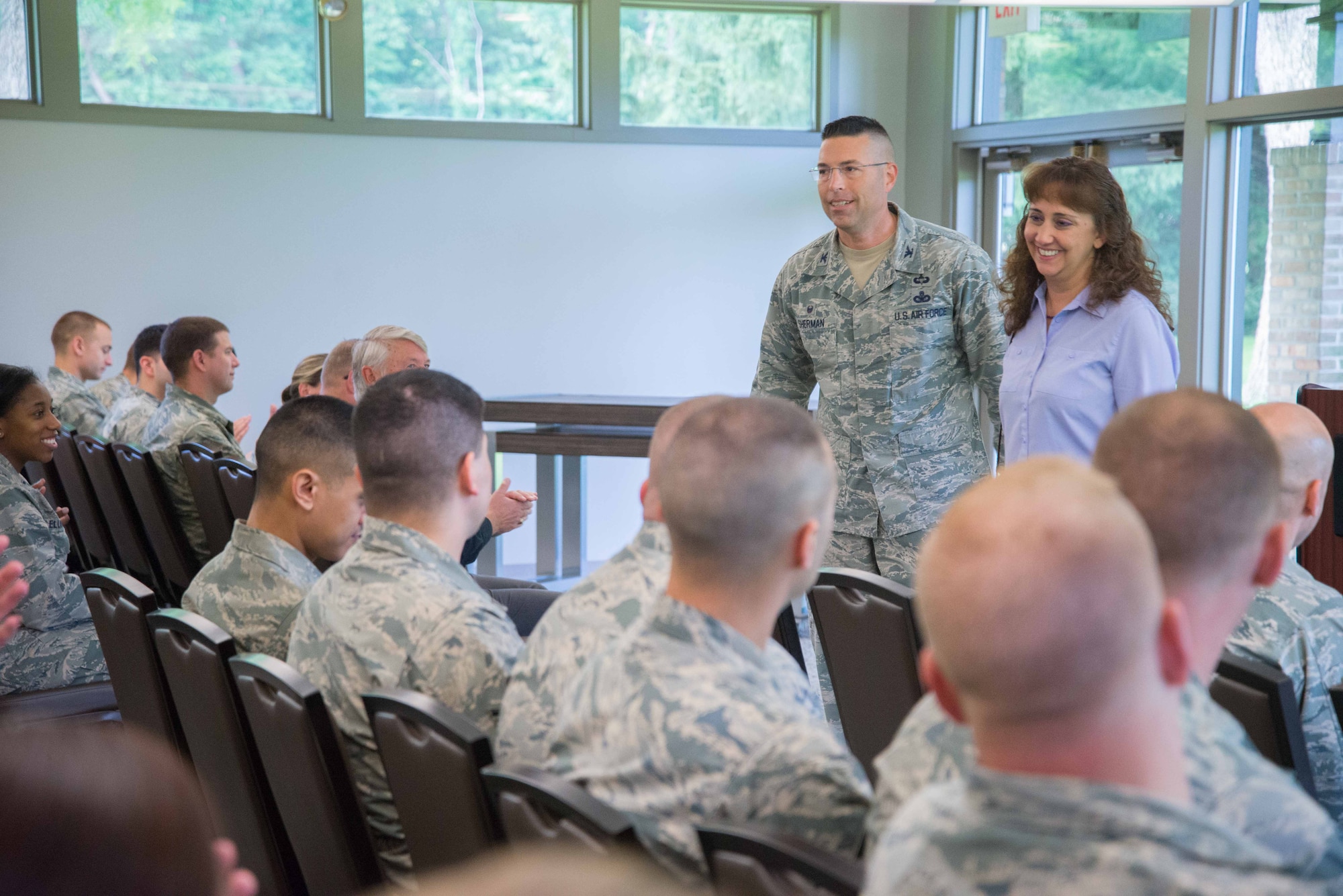WRIGHT-PATTERSON AIR FORCE BASE, Ohio -- Col. Thomas P. Sherman, 88th Air Base Wing and Installation Commander, talks with Wing Staff Agency personnel at his first commander's call at Wright-Patterson Air Force Base  held at the Twin Base Golf Course June 26. he is accompanied by his wife, Laurie. Sherman took command one week earlier in a ceremony at the National Museum of the United States Air Force June 19. (U.S. Air Force photo/John Harrington)