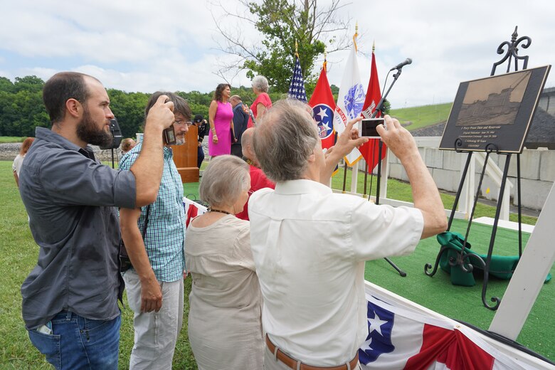People take pictures of the commemorative plaque unveiled during the 50th Anniversary of J. Percy Priest Dam and Reservoir at the dam in Nashville, Tenn., June 29, 2018. (USACE Photo by Mark Rankin)