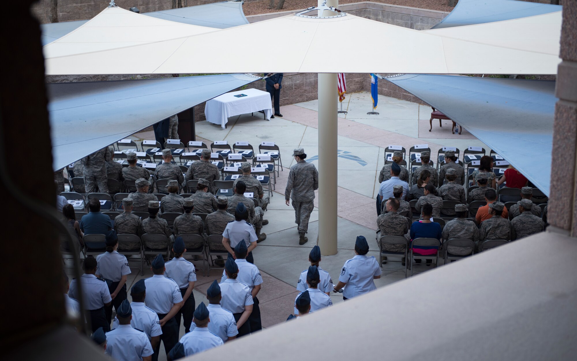 Airmen gather for the 99th Medical Group change of command ceremony at Nellis Air Force Base, Nevada, June 29, 2018. The 99th MDG provides medical care to Department of Defense beneficiaries to ensure maximum wartime readiness and combat capability. (U.S. Air Force photo by Airman 1st Class Andrew D. Sarver)