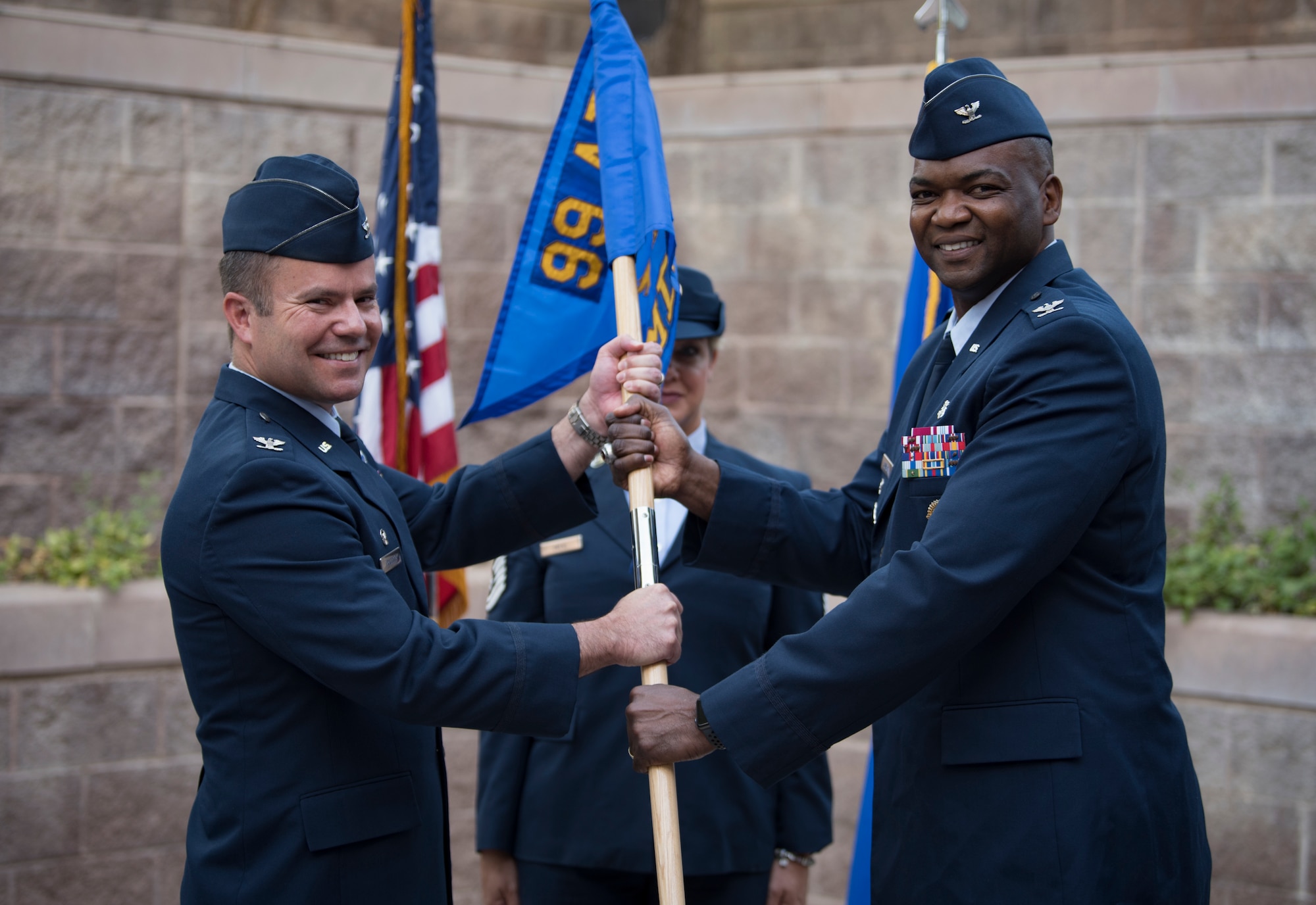 Col. Alfred Flowers Jr., 99th Medical Group incoming commander, assumes command from Col. Cavan Craddock, 99th Air Base Wing commander, during a change of command ceremony at Nellis Air Force Base, Nevada, June 29, 2018. Flowers’ last command was for the 52nd Medical Group at Spangdahlem Air Base, Germany. (U.S. Air Force photo by Airman 1st Class Andrew D. Sarver)