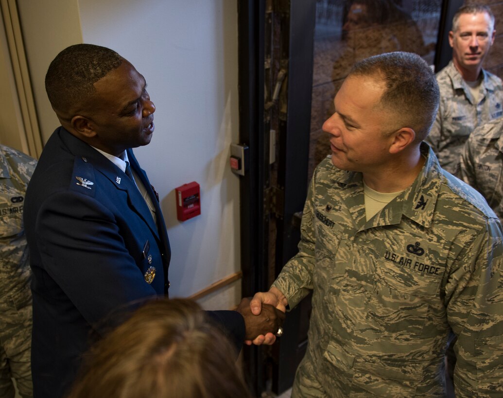 Col. Alfred Flowers Jr., 99th Medical Group commander, greets Col. Mathew Boschert, 99th Mission Support Group commander, during a change of command ceremony at Nellis Air Force Base, Nevada, June 29, 2018. The 99th MDG provides medical care to Department of Defense beneficiaries to ensure maximum wartime readiness and combat capability. (U.S. Air Force photo by Airman 1st Class Andrew D. Sarver)