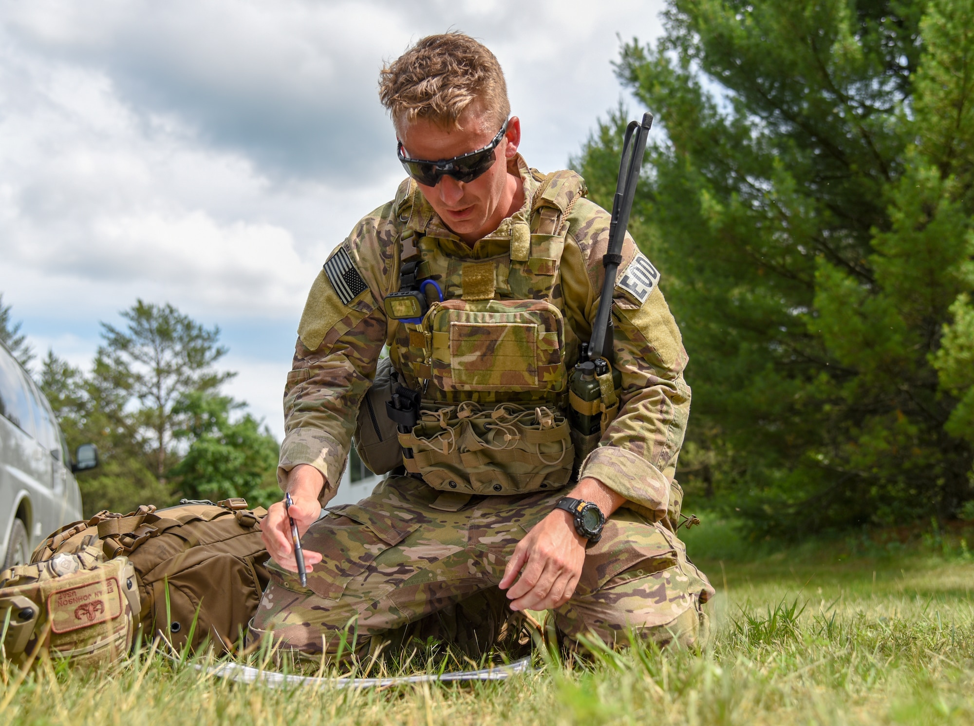 Senior Airman Ethan Johnson, an Explosive Ordnance Disposal technician with the 119th Wing in Hector Field, North Dakota, plans his teams route June 25, 2018, for the Audacious Warrior land navigation compass course at Fort McCoy, Wisconsin. The course allowed Airmen to practice  their skills in map reading, compass use, and pace counting.
(U.S. Air National Guard photo by Airman Cameron Lewis)