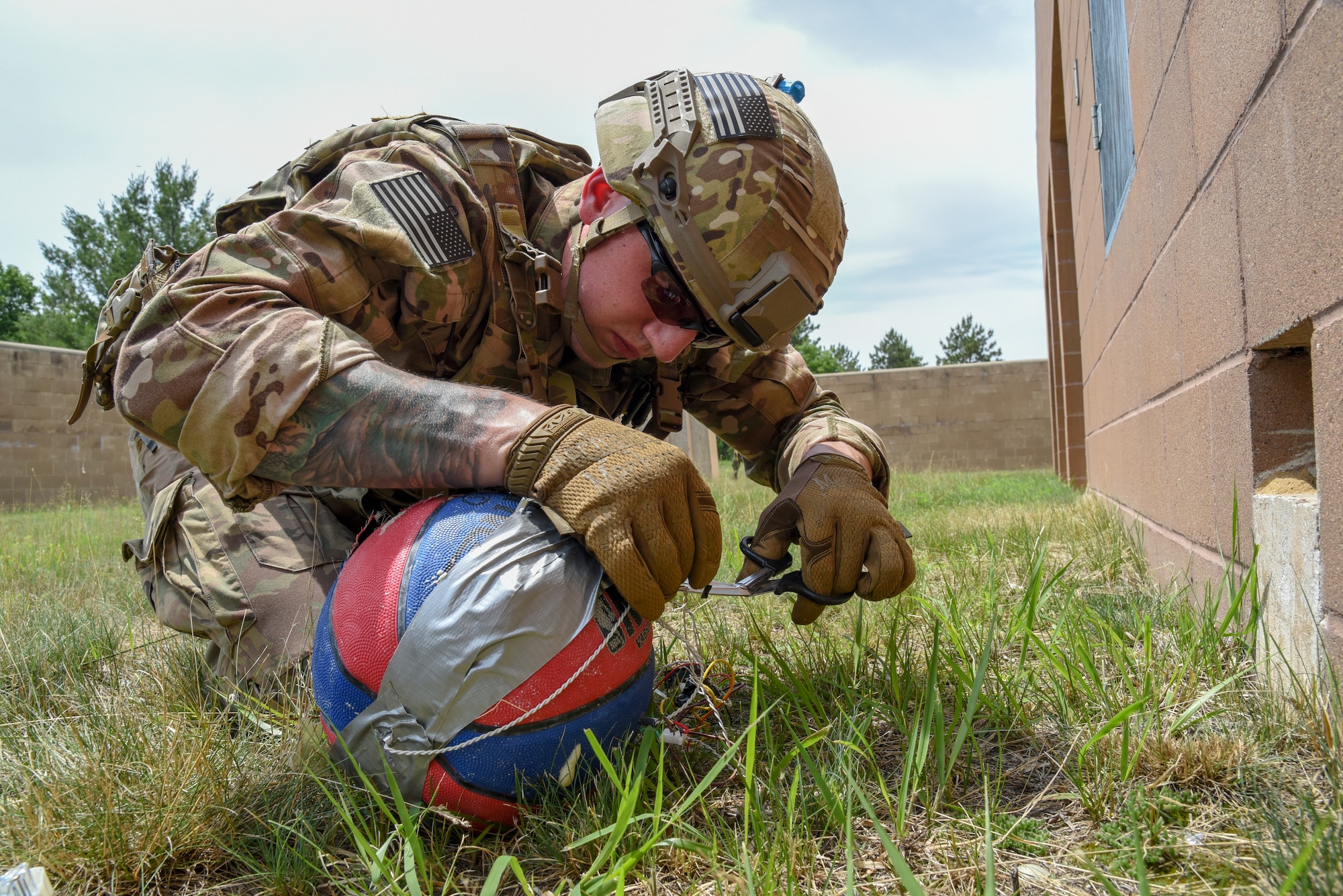 Senior Airman Alec Camp, an Explosive Ordnance Disposal technician with the 142nd Fighter Wing, Portland Air National Guard Base, Oregon, disrupts a possible explosive train June 22, 2018, during a training exercise on Fort McCoy, Wisconsin. The exercise, known as Audacious Warrior, provides EOD Airmen with required training over the course of two weeks.(U.S. Air National Guard photo by Airman Cameron Lewis)