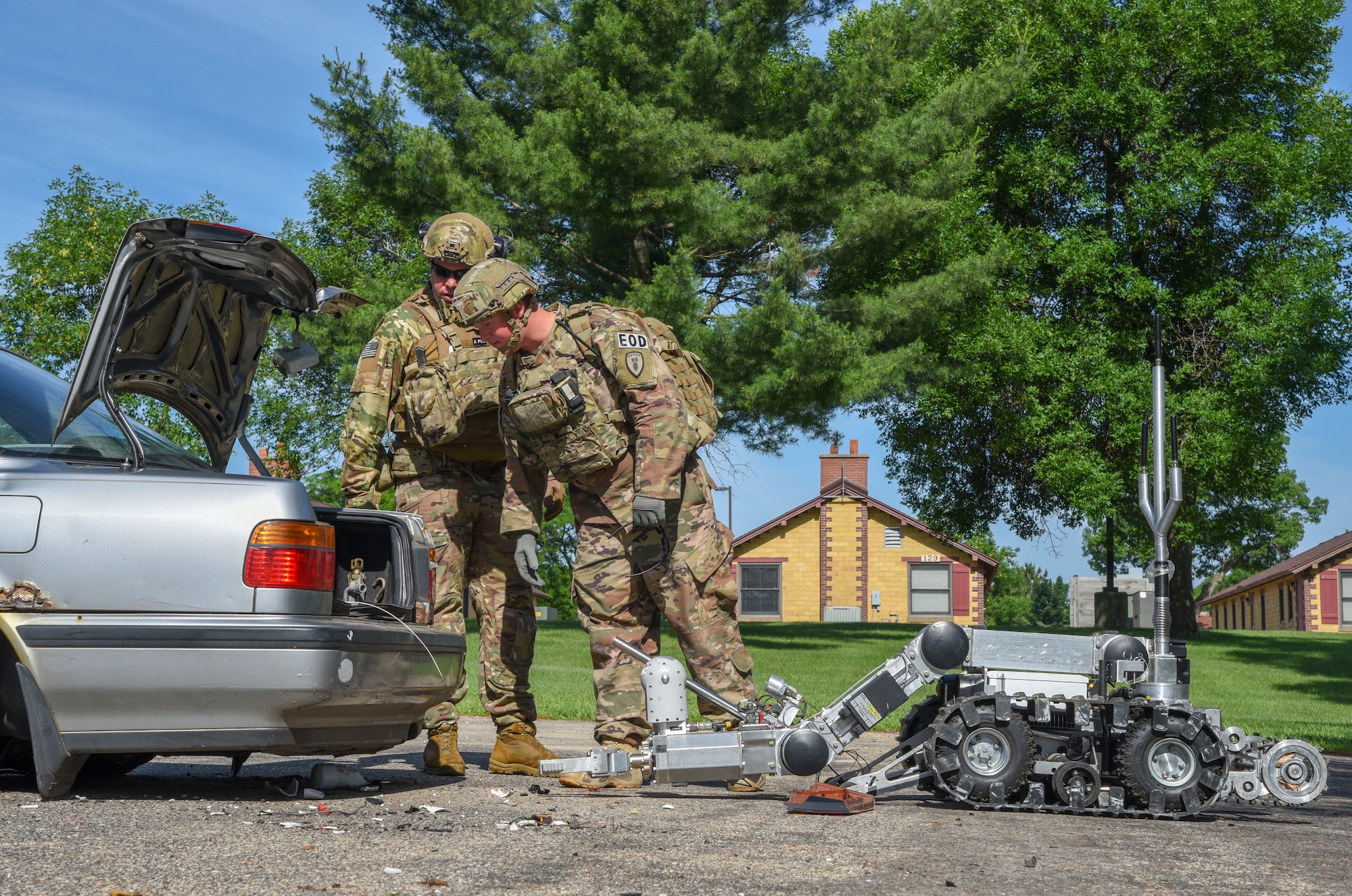 Master Sgt. Jason Ganner, the Explosive Ordnance Disposal resources NCO, for the 142nd Fighter Wing, Portland Air National Guard Base, Oregon, and Staff Sgt. Tyler Porter, an EOD technician with the 155th Air Refueling Wing, confirm the disruption of an explosive device and collect evidence June 23, 2018, at Volk Field Air National Guard Base, Wisconsin. Ganner and Porter are at Volk as part of the annual Audacious Warrior Exercise. (U.S. Air National Guard photo by Airman Cameron Lewis)