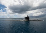 The Los Angeles-class fast-attack submarine USS Oklahoma City (SSN 723) returns to its homeport of Apra Harbor, Guam. Oklahoma City is one of four forward-deployed submarines assigned to Submarine Squadron 15.