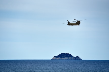 A CH-53 helicopter with the Australian Army brings role-players to the HMAS Canberra during Exercise Sea Raider at Sea June 17, 2018. The helicopters and soldiers were taking part in non-combatant evacuation operations as part of Ex Sea Series 18. The series is designed to train Australian Forces and get them amphibious ready. U.S. Marines and Sailors with Marine Rotational Force - Darwin 18 are working alongside the ADF as part of the Amphibious Task Group.