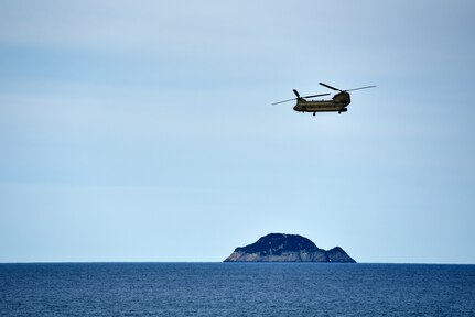 A CH-53 helicopter with the Australian Army brings role-players to the HMAS Canberra during Exercise Sea Raider at Sea June 17, 2018. The helicopters and soldiers were taking part in non-combatant evacuation operations as part of Ex Sea Series 18. The series is designed to train Australian Forces and get them amphibious ready. U.S. Marines and Sailors with Marine Rotational Force - Darwin 18 are working alongside the ADF as part of the Amphibious Task Group.