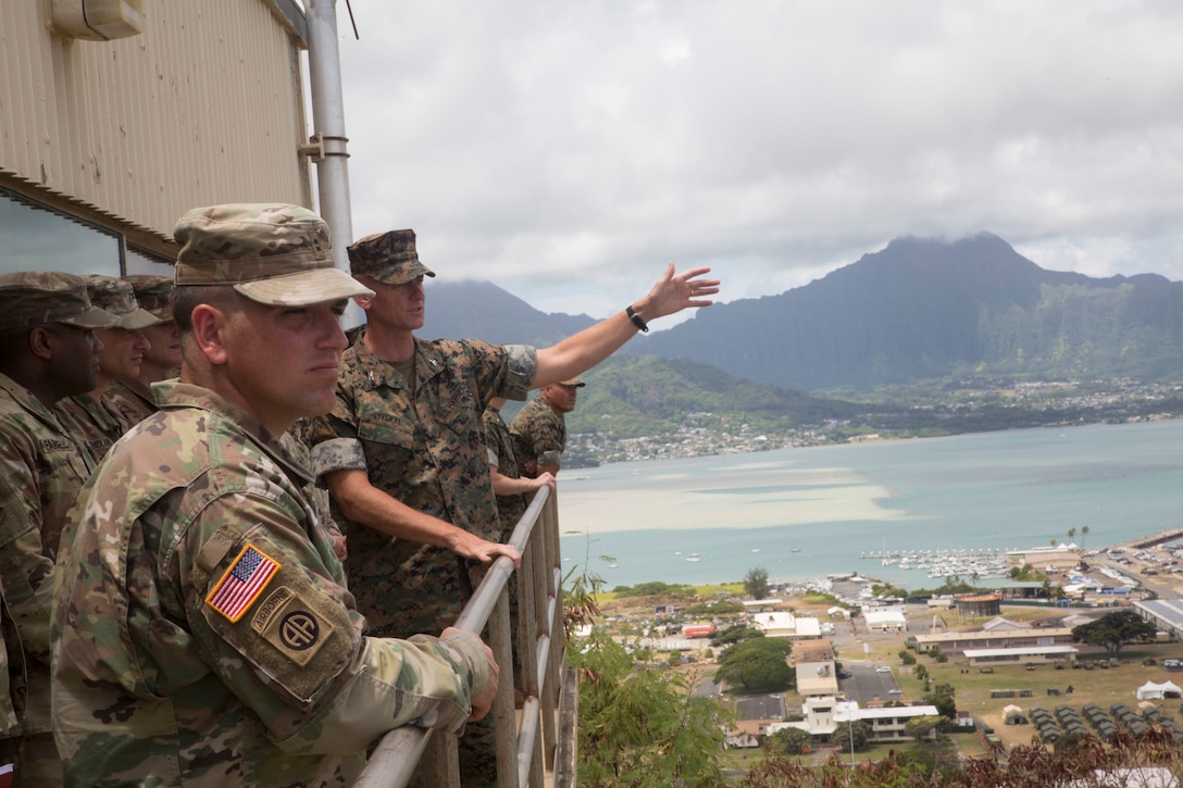 180701-M-KC456-2049 MARINE CORPS BASE HAWAII (July 1, 2018) U.S. Marine Corps Col. Michael S. Styskal, commander, 3rd Marine Regiment, provides a tour of the training facilities aboard Marine Corps Base Hawaii to members of the U.S. Army participating in Rim of the Pacific (RIMPAC) exercise July 1, 2018. RIMPAC provides high-value training for task-organized, highly-capable Marine Air-Ground Task Force and enhances the critical crisis response capability of U.S. Marines in the Pacific. Twenty-five nations, 46 ships, five submarines, about 200 aircraft and 25,000 personnel are participating in RIMPAC from June 27 to Aug. 2 in and around the Hawaiian Islands and Southern California. (U.S. Marine Corps photo by Lance Cpl. Thomas P. Miller)