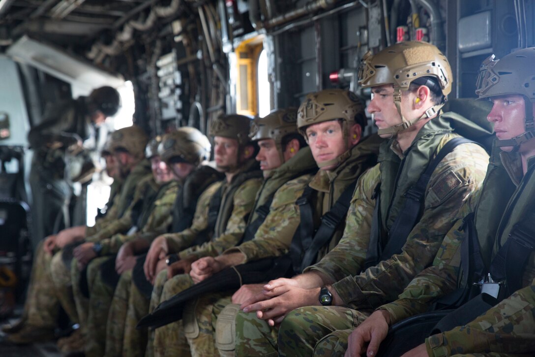 180630-M-KC456-1020 MARINE CORPS BASE HAWAII (June 30, 2018) Australian soldiers board a CH-53 E Super Stallion helicopter prior to conducting a helo cast during Rim of the Pacific (RIMPAC) exercise at Marine Corps Base Hawaii June 30, 2018. The helo cast training is meant to prepare the service members for an amphibious insertion during RIMPAC. RIMPAC provides high-value training for task-organized, highly-capable Marine Air-Ground Task Force and enhances the critical crisis response capability of U.S. Marines in the Pacific. Twenty-five nations, 46 ships, five submarines, about 200 aircraft and 25,000 personnel are participating in RIMPAC from June 27 to Aug. 2 in and around the Hawaiian Islands and Southern California. (U.S. Marine Corps photo by Lance Cpl. Thomas P. Miller)