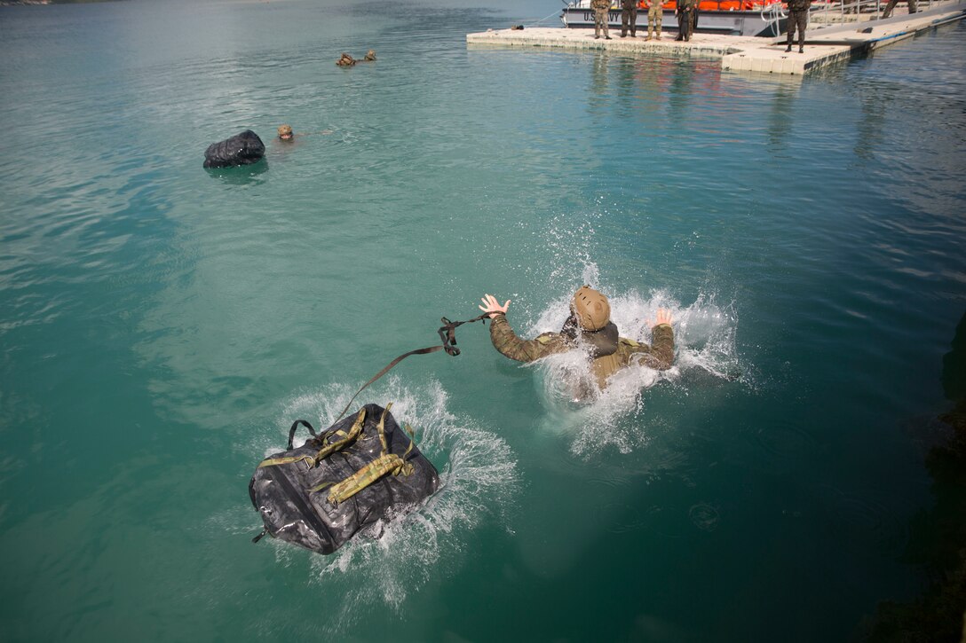 180629-M-KC456-1051 MARINE CORPS BASE HAWAII (June 29, 2018) An Australian soldier swims to shore during a helo-cast drills as part of Rim of the Pacific (RIMPAC) exercise on Marine Corps Base Hawaii June 29, 2018. The helo-cast training is meant to prepare the service members for an amphibious insertion during RIMPAC. RIMPAC provides high-value training for task-organized, highly-capable Marine Air-Ground Task Force and enhances the critical crisis response capability of U.S. Marines in the Pacific. Twenty-five nations, 46 ships, five submarines, about 200 aircraft and 25,000 personnel are participating in RIMPAC from June 27 to Aug. 2 in and around the Hawaiian Islands and Southern California. (U.S. Marine Corps photo by Lance Cpl. Thomas P. Miller)