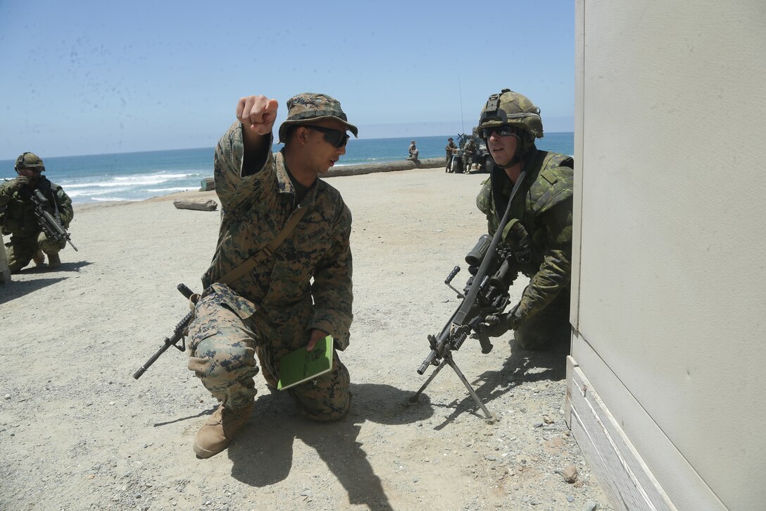 U.S. Marines with 2nd Battalion, 1st Marine Regiment,  and Canadian Armed Forces conduct bounding drills at a combat town during assault amphibious vehicle familiarization training during training as part of Rim of the Pacific (RIMPAC) exercise at Marine Corps Base Camp Pendleton, California, June 28, 2018. Marines training with partner nations from around the world enhances prowess. RIMPAC provides high-value training for task-organized, highly-capable Marine Air-Ground Task Force and enhances the critical crisis response capability of U.S. Marines in the Pacific. (U.S. Marine Corps photo by Cpl. Jeremy Laboy)