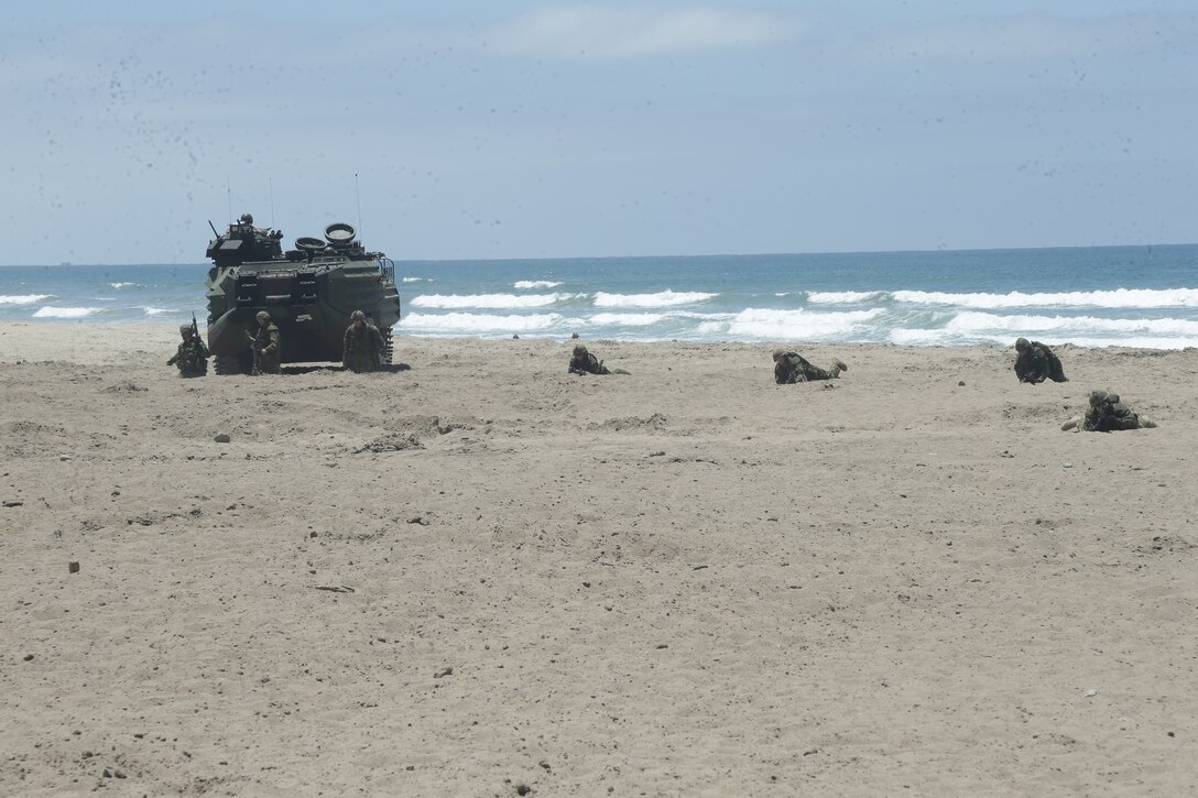 Canadian Armed Forces conduct bounding drills at an assault amphibious vehicle familiarization training during Rim of the Pacific (RIMPAC) exercise at Marine Corps Base Camp Pendleton, California, June 28, 2018. Marines training with partner nations from around the world enhances prowess. RIMPAC provides high-value training for task-organized, highly-capable Marine Air-Ground Task Force and enhances the critical crisis response capability of U.S. Marines in the Pacific.  (U.S. Marine Corps photo by Cpl. Jeremy Laboy)