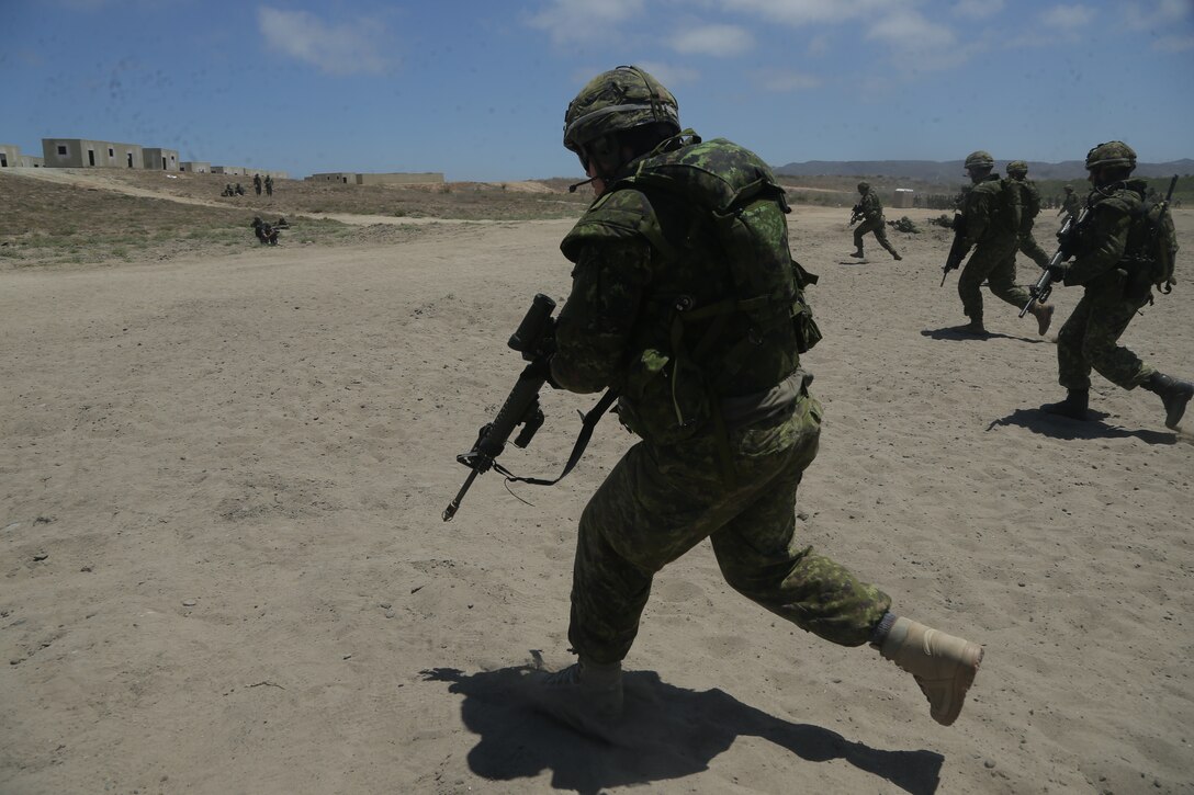 Canadian Armed Forces conduct bounding drills at an assault amphibious vehicle familiarization training during Rim of the Pacific (RIMPAC) exercise at Marine Corps Base Camp Pendleton, California, June 28, 2018. Marines training with partner nations from around the world enhances prowess. RIMPAC provides high-value training for task-organized, highly-capable Marine Air-Ground Task Force and enhances the critical crisis response capability of U.S. Marines in the Pacific.  (U.S. Marine Corps photo by Cpl. Jeremy Laboy)