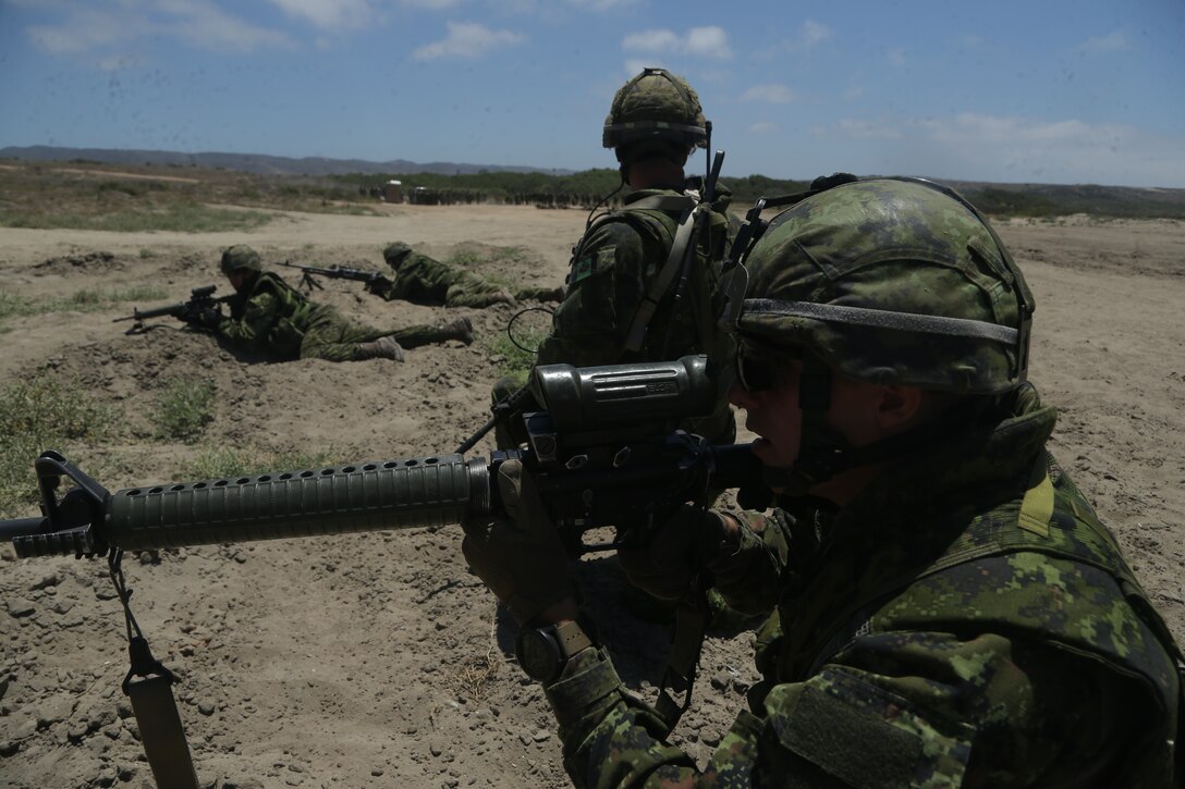 Canadian Armed Forces conduct bounding drills at an assault amphibious vehicle familiarization training during Rim of the Pacific (RIMPAC) exercise at Marine Corps Base Camp Pendleton, California, June 28, 2018. Marines training with partner nations from around the world enhances prowess. RIMPAC provides high-value training for task-organized, highly-capable Marine Air-Ground Task Force and enhances the critical crisis response capability of U.S. Marines in the Pacific. (U.S. Marine Corps photo by Cpl. Jeremy Laboy)