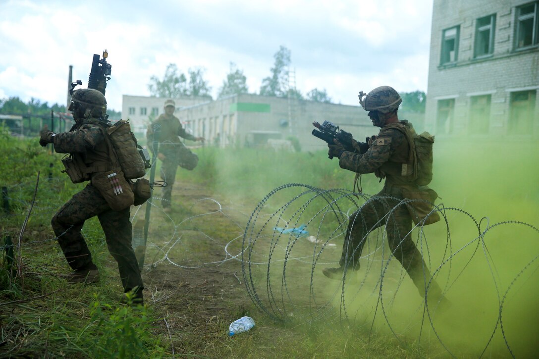 U.S. Marines from 1st Battalion, 6th Marines maneuver through an objective during Exercise Saber Strike 18, Latvia, June 12, 2018. Exercise Saber Strike is an integrated field-training exercise that occurs annually throughout Estonia, Latvia, Lithuania and Poland, increasing joint operational capability and enhancing the NATO alliance. (U.S. Marine Corps photo by Lance Cpl. Angel D. Travis)