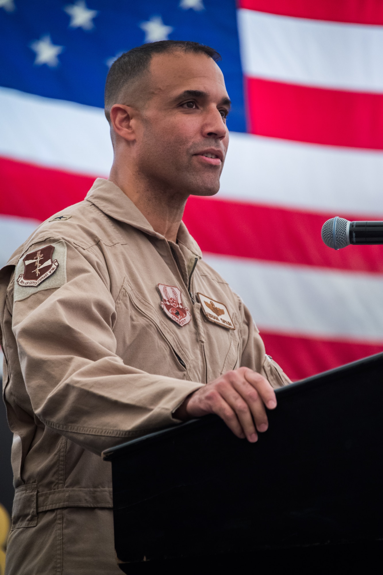 U.S. Air Force Brig. Gen. Adrian L. Spain, commander of the 380th Air Expeditionary Wing, speaks to a crowd gathered in attendance for a change of command ceremony at Al Dhafra Air Base, July 2, 2018. (U.S. Air Force photo by Tech. Sgt. Nieko Carzis)