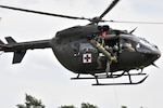 Nebraska and Iowa National Guard Soldiers assigned to 1st Squadron, 376th Aviation Battalion conduct a hoist and lift demonstration from their UH72-A Lakota June 21, 2018, at Grafenwoehr Training Area, Germany. The units are part of a four-month rotational deployment to Germany where they will assume the real world MEDEVAC mission for Hohenfels and Grafenwoehr from their active duty unit counterparts.