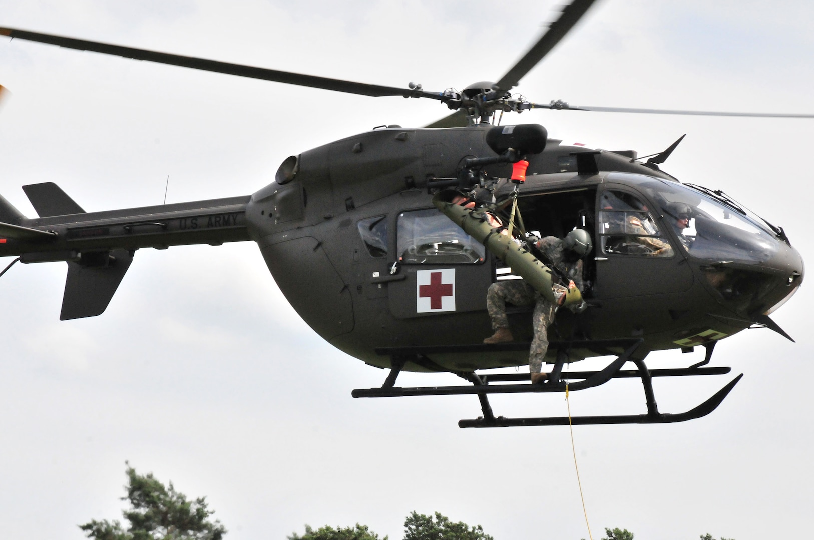 Nebraska and Iowa National Guard Soldiers assigned to 1st Squadron, 376th Aviation Battalion conduct a hoist and lift demonstration from their UH72-A Lakota June 21, 2018, at Grafenwoehr Training Area, Germany. The units are part of a four-month rotational deployment to Germany where they will assume the real world MEDEVAC mission for Hohenfels and Grafenwoehr from their active duty unit counterparts.