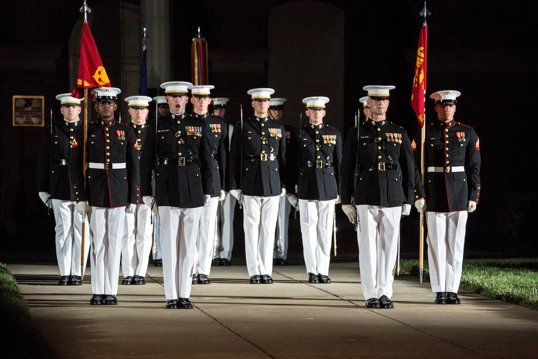 Marines with Marine Barracks Washington D.C. march down Center Walk during a Friday Evening Parade at the Barracks, June 29, 2018. The guest of honor for the ceremony was the Under Secretary of the Navy, Thomas B. Modly, and the hosting official was the Assistant Commandant of the Marine Corps, Gen. Glenn M. Walters.