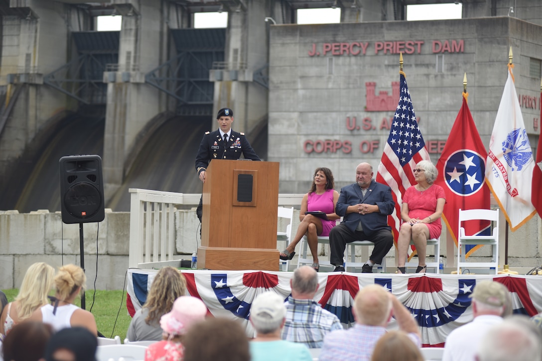 Maj. Justin Toole, U.S. Army Corps of Engineers Nashville District deputy commander, talks about project benefits during the 50th Anniversary of J. Percy Priest Dam and Reservoir at the dam in Nashville, Tenn., June 29, 2018.  The major said President Lyndon B. Johnson’s vision of reducing flooding, providing water, creating hydropower, and recreation has come to fruition over the past 50 years. (USACE Photo by Lee Roberts)