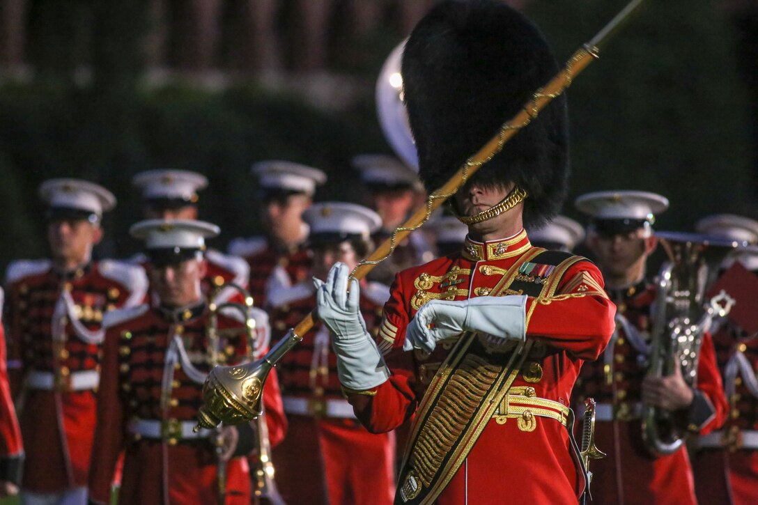 Marines with "The Presidents Own" United States Marine Band march to their positions during a Friday Evening Parade at Marine Barracks Washington D.C., June 29, 2018. The guest of honor for the ceremony was the Under Secretary of the Navy, Thomas B. Modly, and the hosting official was the Assistant Commandant of the Marine Corps, Gen. Glenn M. Walters.