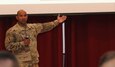 U.S. Army Lt. Col. Eddie Diaz, Deputy ARCENT G-6, addresses the audience on the individual responsibilities of maintaining cyber security.