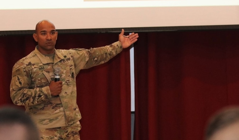 U.S. Army Lt. Col. Eddie Diaz, Deputy ARCENT G-6, addresses the audience on the individual responsibilities of maintaining cyber security.