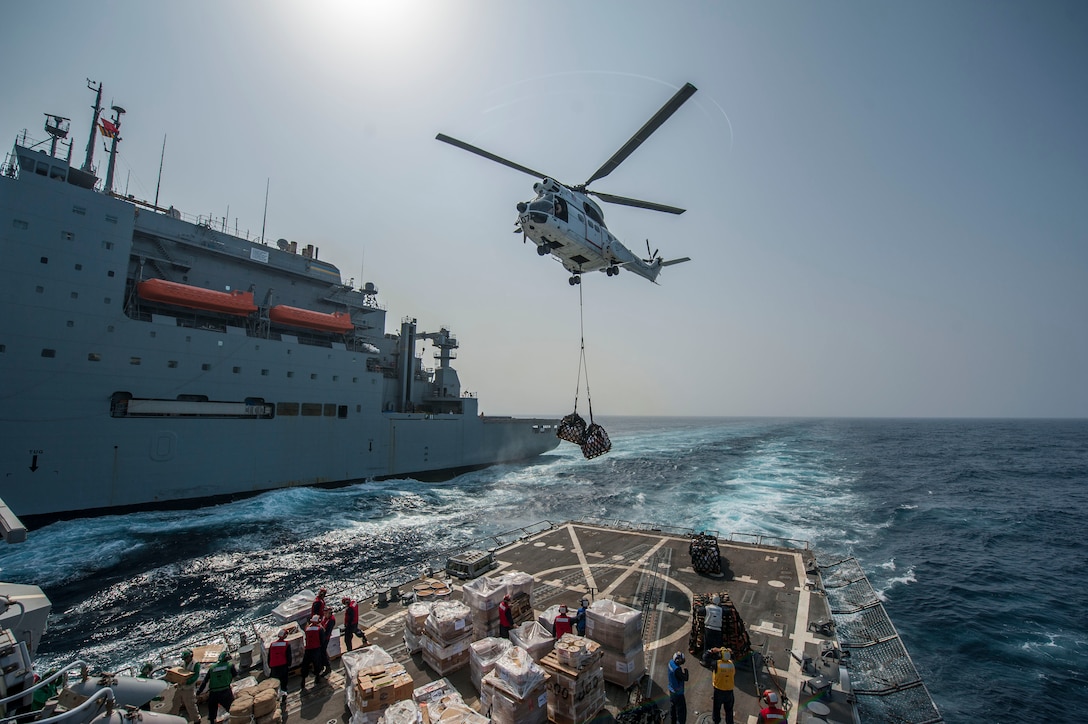 SA-330J Puma helicopter drops supplies on flight deck of USS Truxtun during vertical replenishment with Military Sealift Command dry cargo and ammunition ship USNS Richard E. Byrd, Red Sea, April 12, 2014 (U.S. Navy/Scott Barnes)