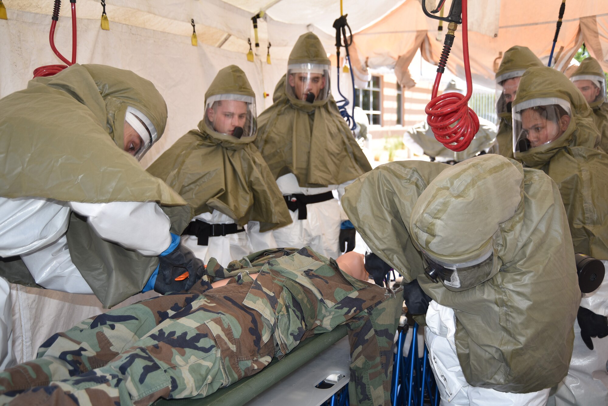 Members of the 377th Medical Group test their triage and decontamination skills during In-Place Patient Decontamination training June 28 at Kirtland AFB’s 377th MDG Main Clinic.