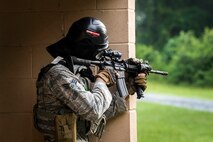 An Airman from the 23d Security Forces Squadron (SFS) fires an M4 carbine during a Force on Force training scenario, June 29, 2018, at Moody Air Force Base, Ga. This training was held to ensure SFS Airmen are proficient in various tactics and procedures such as: building clear out, team movements, hostage rescue and properly applying cover fire. The scenario required Airmen to maneuver through multiple buildings to rescue a simulated victim guarded by opposing forces. (U.S. Air Force photo Airman 1st Class Eugene Oliver)