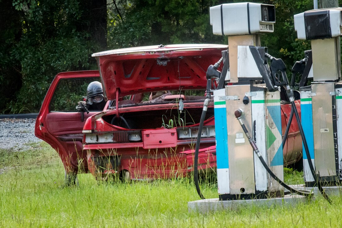 An Airman from the 23d Security Forces Squadron (SFS) scans his perimeter during a Force on Force training scenario, June 29, 2018, at Moody Air Force, Ga. This training was held to ensure SFS Airmen are proficient in various tactics and procedures such as: building clear out, team movements, hostage rescue and properly applying cover fire. The scenario required Airmen to maneuver through multiple buildings to rescue a simulated victim guarded by opposing forces. (U.S. Air Force photo Airman 1st Class Eugene Oliver)
