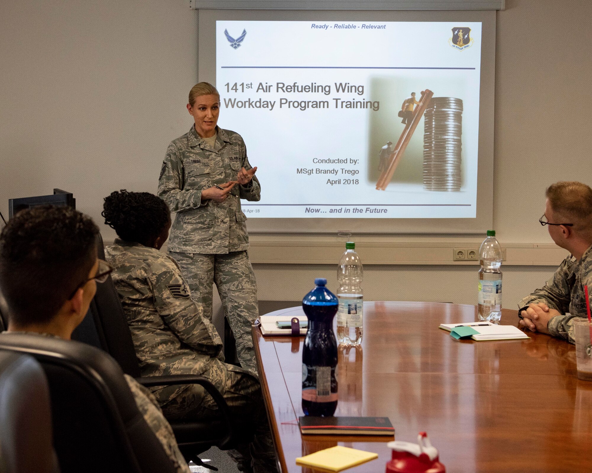 MSgt Sgt. Brandy Trego, budget analyst with the 141st Air Refueling Wing, briefs Airmen from the 52nd Fighter Wing’s comptroller flight on Air National Guard processes during training April 17, 2018 at Spangdahlem Air Base, Germany. Trego was one of nearly 20 Guardsmen that had the opportunity to complete their annual training alongside their active duty counterparts in early April at Spangdahlem.