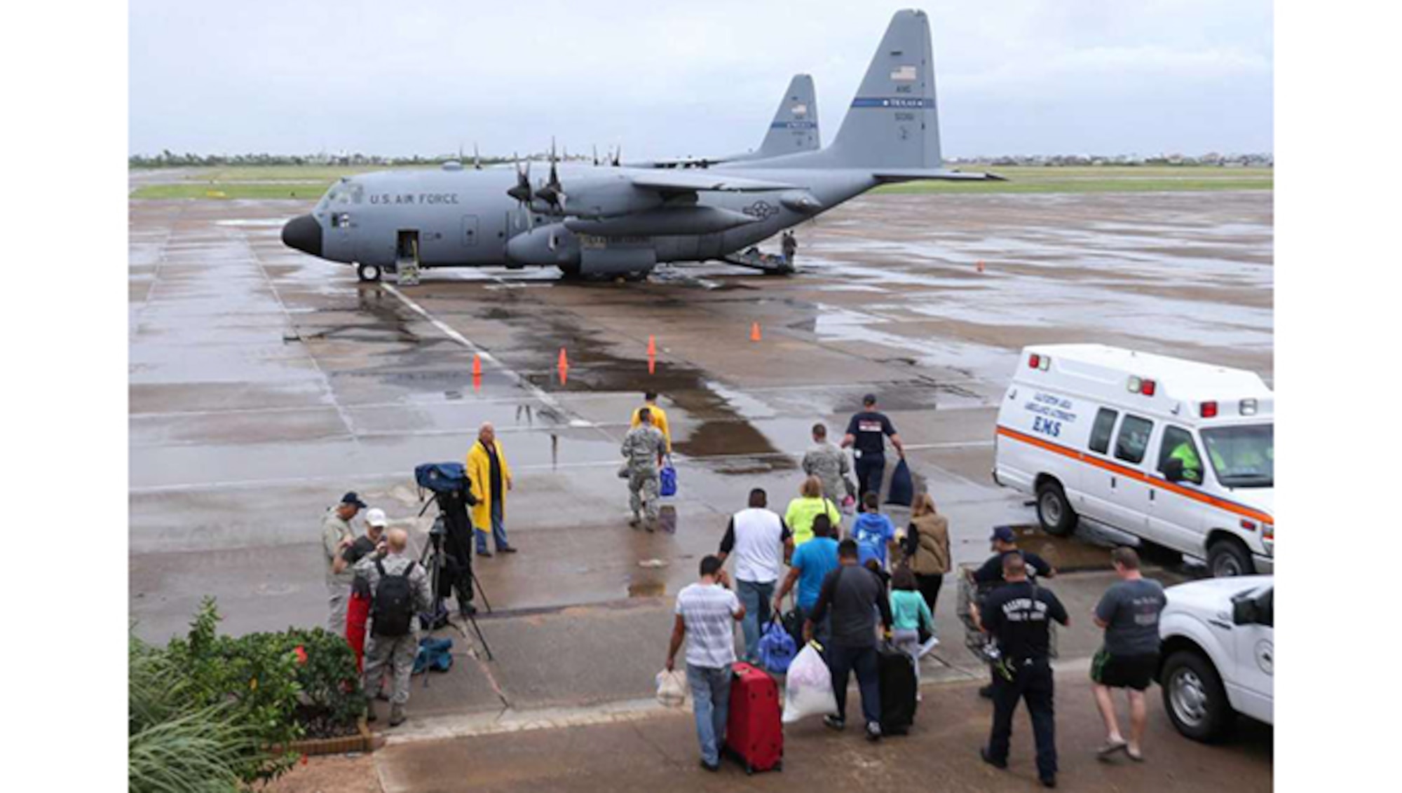 Dickinson flood evacuees boarding an airplane at Scholes International Airport on Monday, August 28, 2017, in Galveston. Texas Air National Guard planes were taking these flood evacuees to other cities after they spent Sunday night at a Galveston shelter, an example of how citizen airmen help during disasters.