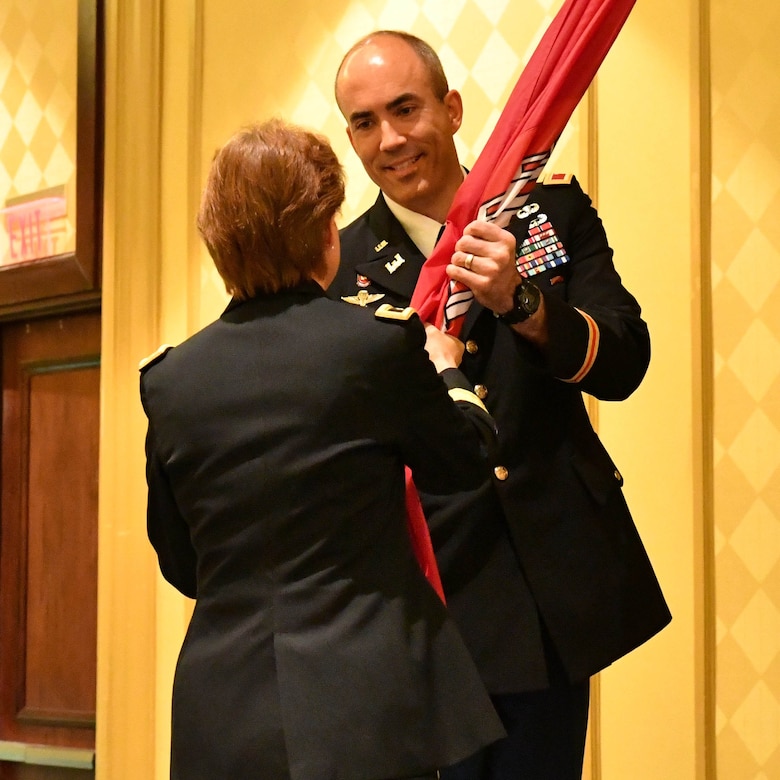 Col. Sebastien P. Joly receives the U.S. Army Corps of Engineers flag from Brigadier General Diana M. Holland during the USACE Mobile District Change of Command ceremony on June 29, 2018 at the Renaissance Riverview Hotel in Mobile, Al. Joly became the 53rd commander of the Mobile District.