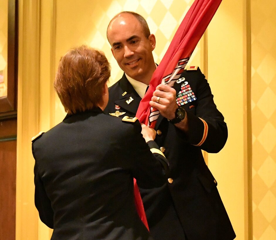 Col. Sebastien P. Joly receives the U.S. Army Corps of Engineers flag from Brigadier General Diana M. Holland during the USACE Mobile District Change of Command ceremony on June 29, 2018 at the Renaissance Riverview Hotel in Mobile, Al. Joly became the 53rd commander of the Mobile District.