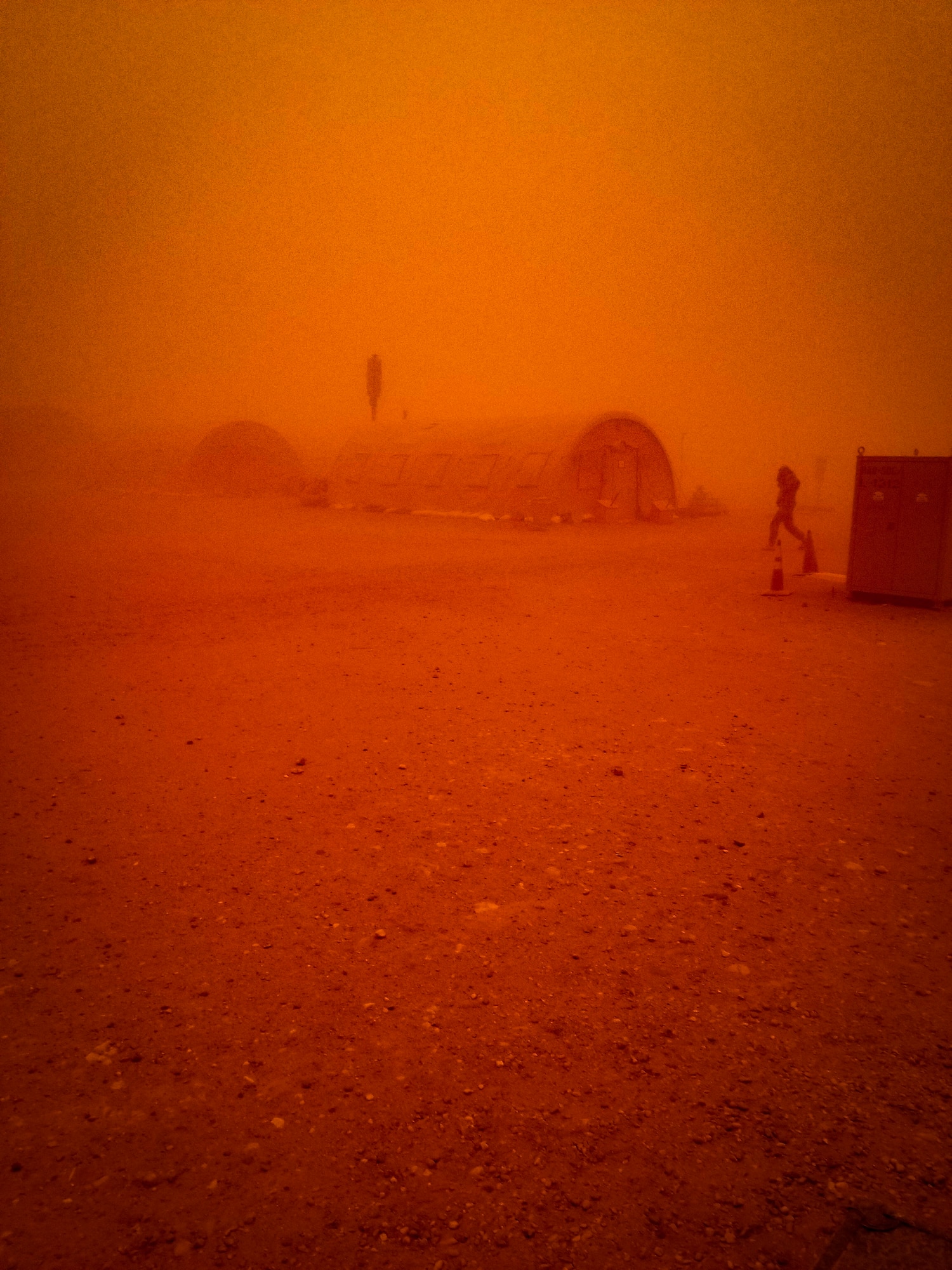 Visibility transitions to a red tint as a sand storm passes through the region at Nigerien Air Base 201, Niger, June 24, 2018. This was the largest sand storm of the season so far, with sustained winds in excess of 50 knots. (U.S. Air Force courtesy photo by Airman 1st Class Anthony Montero)