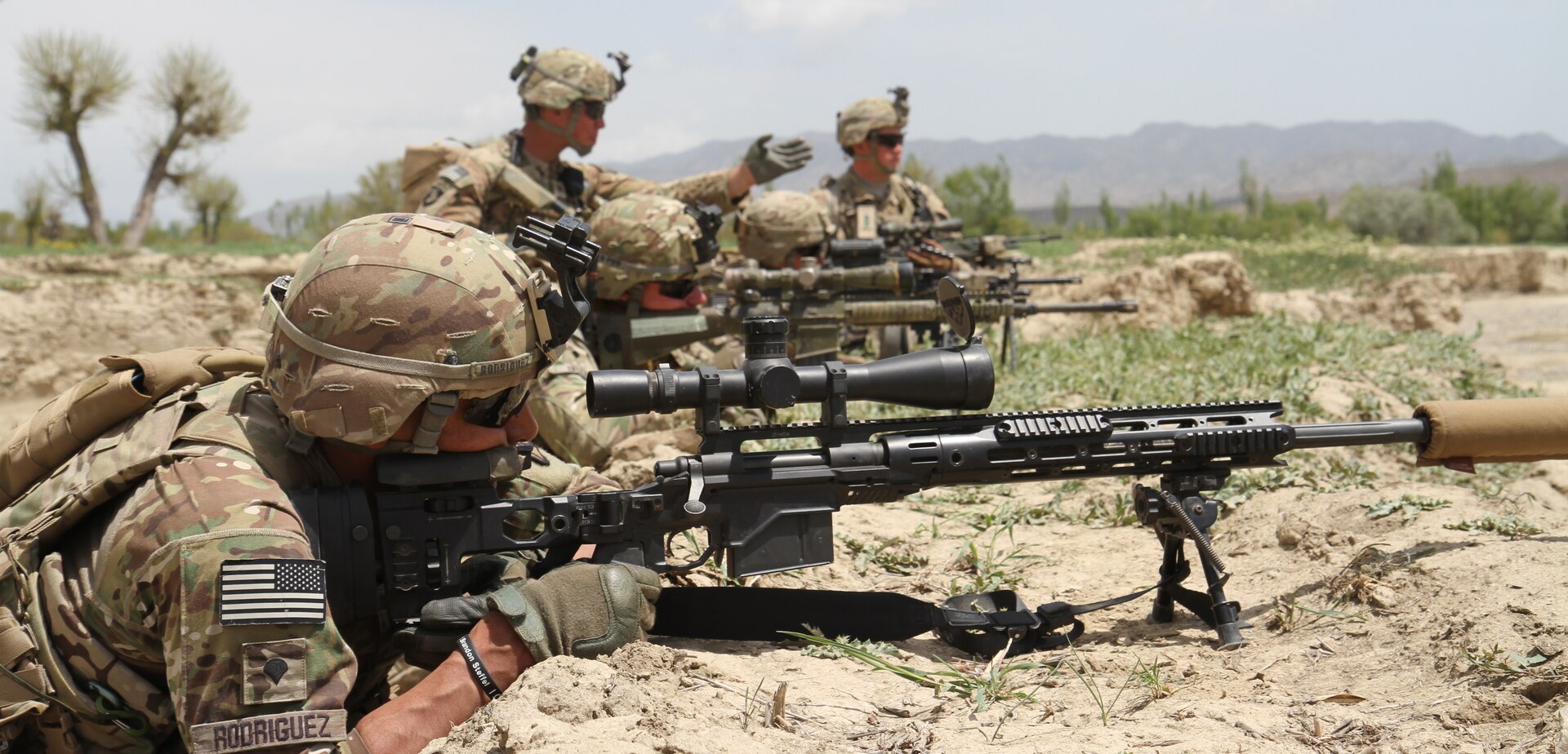 U.S. Marine Corps sniper with Task Force Southwest sights in with rifle combat optic on M4 carbine during security post for advising mission with 1st Brigade, Afghan National Army 215th Corps, as they conduct Operation Maiwand 12 at Camp Shorserack, Afghanistan, March 13, 2018 (U.S. Marine Corps/Conner Robbins)