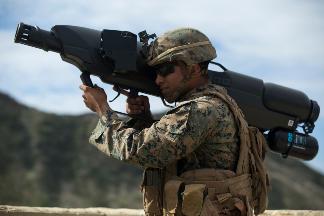 Marine with 3rd Battalion, 4th Marines, Kilo Company, uses weapon that has capabilities to shoot down drones with net during Urban Advanced Naval Technology Exercise 2018, Camp Pendleton, California, March 20, 2018 (U.S. Marine Corps/Laiqa Hitt)