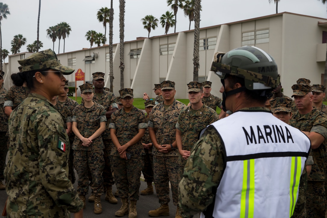 Mexican sailors, with Corvette Licensed Naval Health Service, brief U.S. Marines, with 15th Marine Expeditionary Unit, during a humanitarian assistance and disaster relief demonstration as part of Rim of the Pacific (RIMPAC) exercise at Marine Corps Base Camp Pendleton, California, June 29, 2018.  Marines training with the U.S. Navy and partner nations from around the world enhances prowess. RIMPAC provides high-value training for task-organized, highly-capable Marine Air-Ground Task Force and enhances the critical crisis response capability of U.S. Marines in the Pacific.
