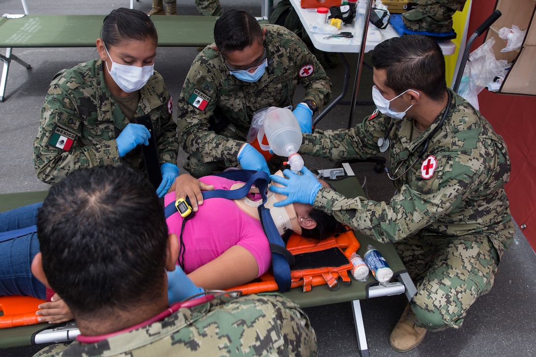 Mexican sailors, with Corvette Licensed Naval Health Service, treat a simulated casualty during a humanitarian assistance and disaster relief demonstration as part of Rim of the Pacific (RIMPAC) exercise at Marine Corps Base Camp Pendleton, California, June 29, 2018. Marines training with partner nations from around the world enhances prowess. RIMPAC provides high-value training for task-organized, highly-capable Marine Air-Ground Task Force and enhances the critical crisis response capability of U.S. Marines in the Pacific.