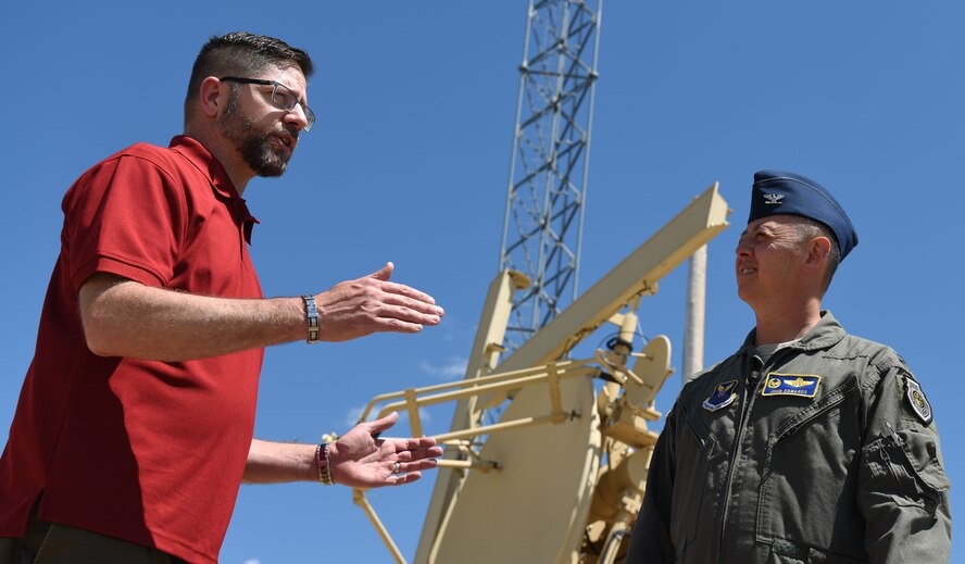 Shawn Pyle, 28th Operations Support Squadron range manager, explains the use of a multiple-input single-output radar site on the Powder River Training Complex at Colony, Wyoming, June 21, 2018. Ellsworth leadership is working closely with community members to alleviate their concerns about low flying aircraft and high noise levels. (U.S. Air Force phot by Airman 1st Class Thomas Karol)