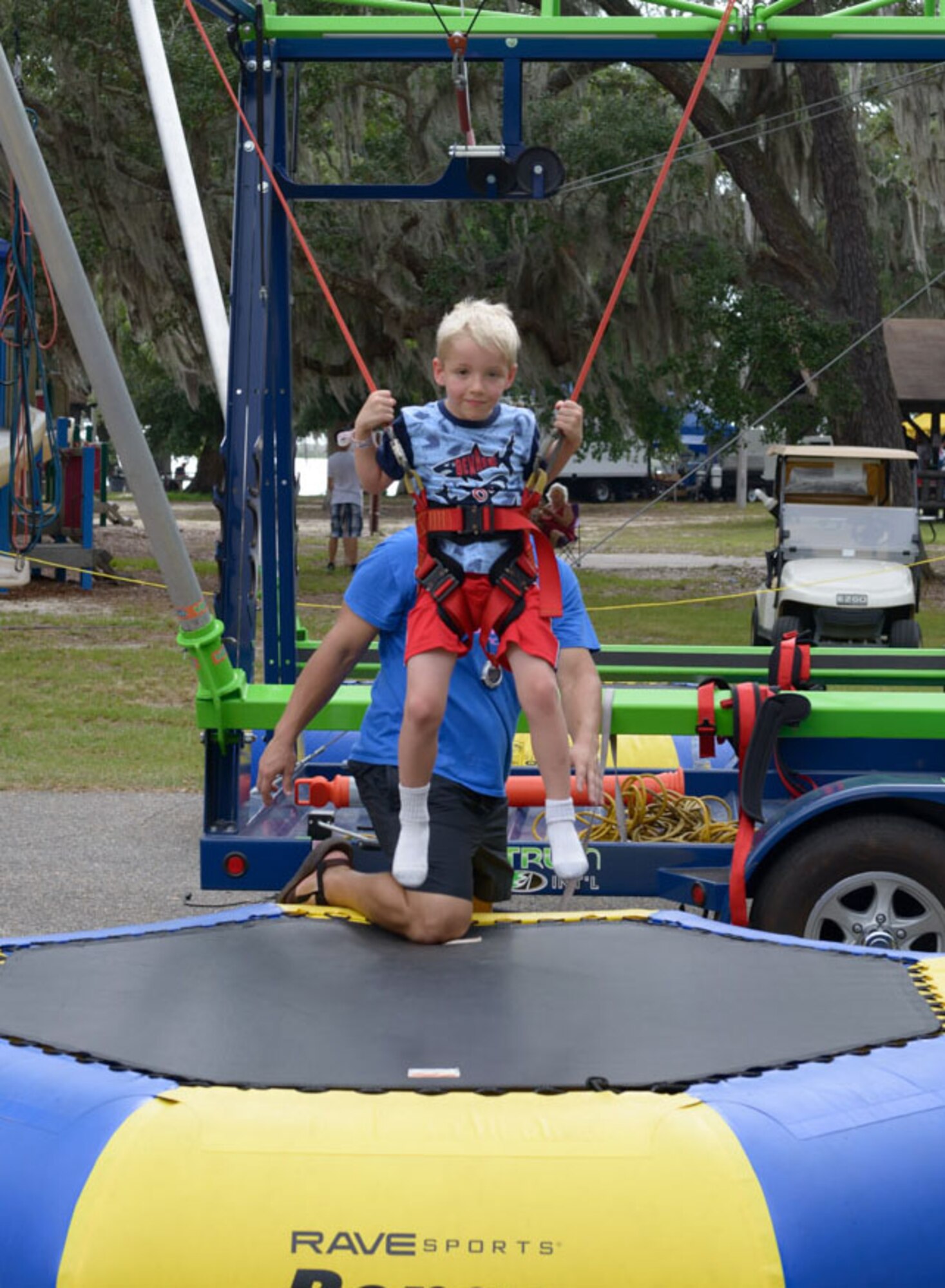 Brody Lindskog, son of U.S. Air Force Tech. Sgt. Levi Lindskog, 4th Space Launch Squadron missile and space system maintenance, Vandenberg Air Force Base, California, jumps on a trampoline during Freedom Fest at Marina Park on Keesler Air Force Base, Mississippi, June 30, 2018. The event included carnival rides, a burger cook-off, hot wings and watermelon eating competitions and a fireworks display. (U.S. Air Force photo by Andre’ Askew)